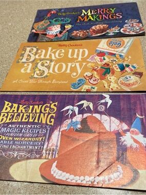Betty Crocker cookbook set with purple, orange, and yellow covers